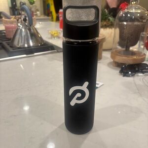Peloton glass water bottle with rubber cover